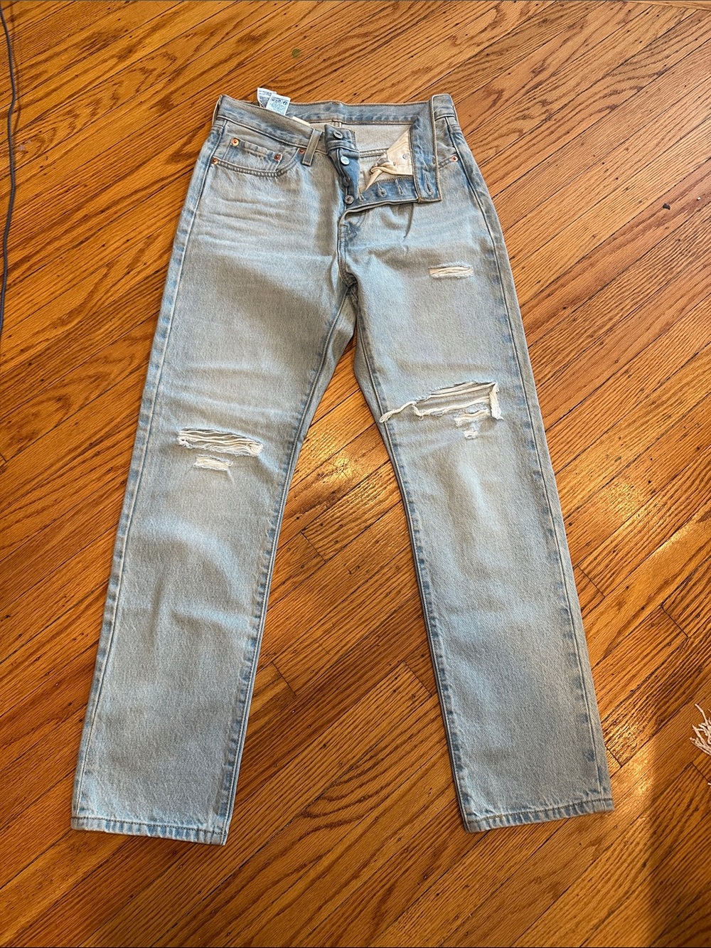 Levi's Light Blue Straight Women's Jeans with Knee Rips